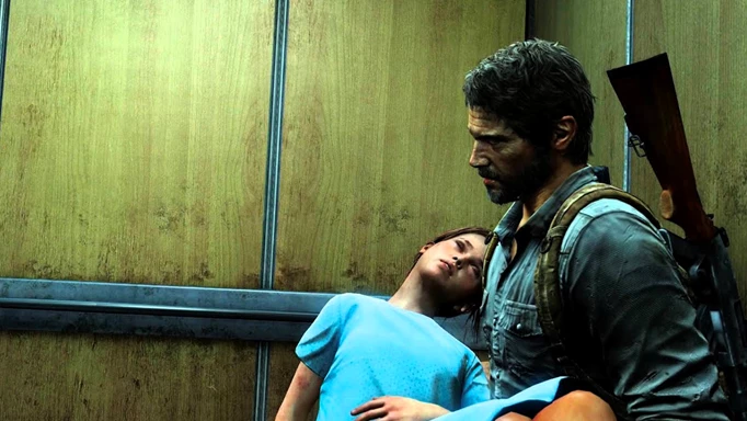 Joel, played by Troy Baker, carries Ellie in a hospital gown in The Last of Us Remastered.