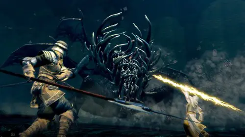 Key art from Dark Souls with two characters attacking the Gaping Dragon boss