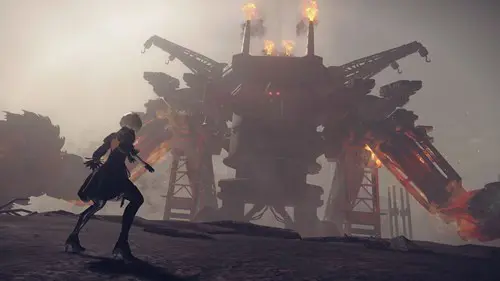 2B faces off against a mechanical titan in NieR Automata.