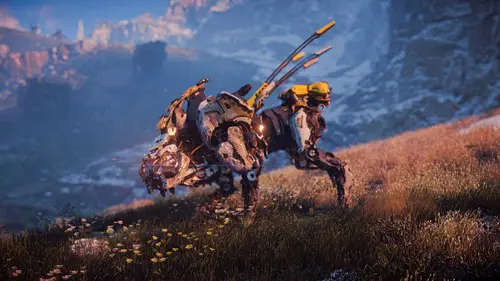 a dog-like robot from horizon forbidden west stalks along a grassy plain