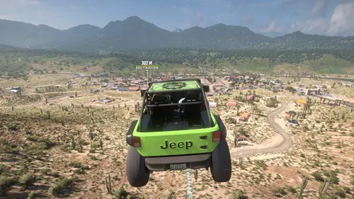 A green jeep flies over a green landscape with mountains in the distance.