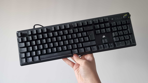 Corsair K70 Core keyboard held up by reviewer