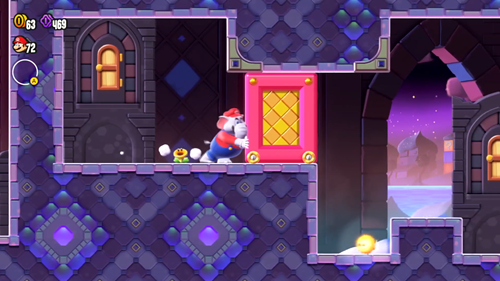 Mario pushing a pink block in Super Mario Wonder