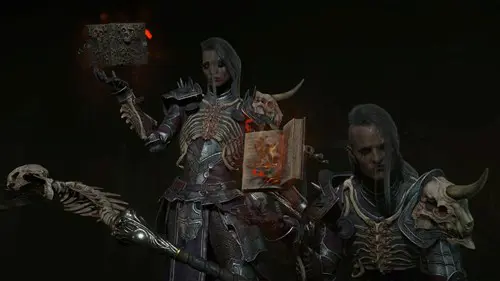 Image of two Necromancers holding a book in Diablo 4