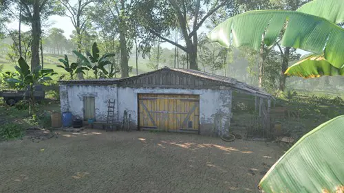 A barn surrounded by trees.