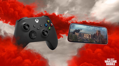 An Xbox controller beside a phone playing Warzone Mobile