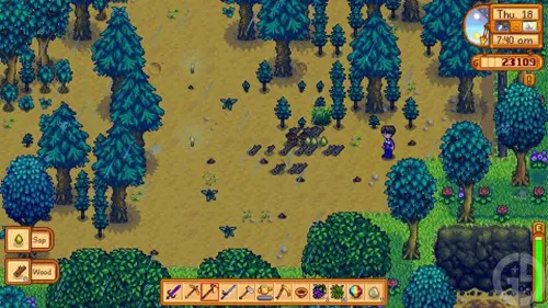 A pile of wood waiting to be collected in Stardew Valley