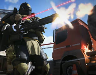 armoured-man-firing-gattling-gun-in-warzone-mobile.jpg