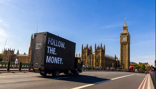 Payday 3's heist van driving across London.